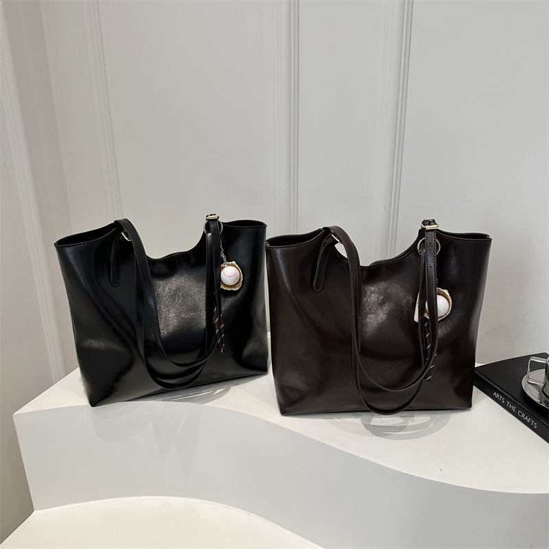 Bolsa de moda suave pittot2025 primavera nueva gran capacidad de viaje minimalista bolso de hombro para estudiantes universitarios