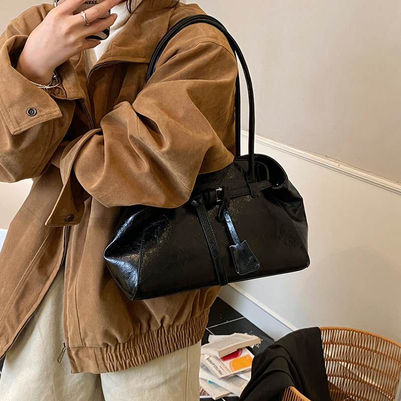 Alta textura retro gran capacidad hombro brazo bolso de mujer 2025 nuevo otoño invierno universal bolso de mano de viaje