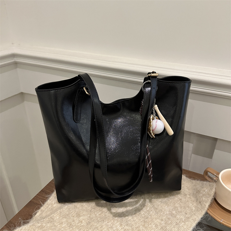 Bolsa de moda suave pittot2025 primavera nueva gran capacidad de viaje minimalista bolso de hombro para estudiantes universitarios