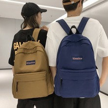 双肩包女跨境专供潮流学生书包简约百搭日韩休闲旅行背包男双肩包