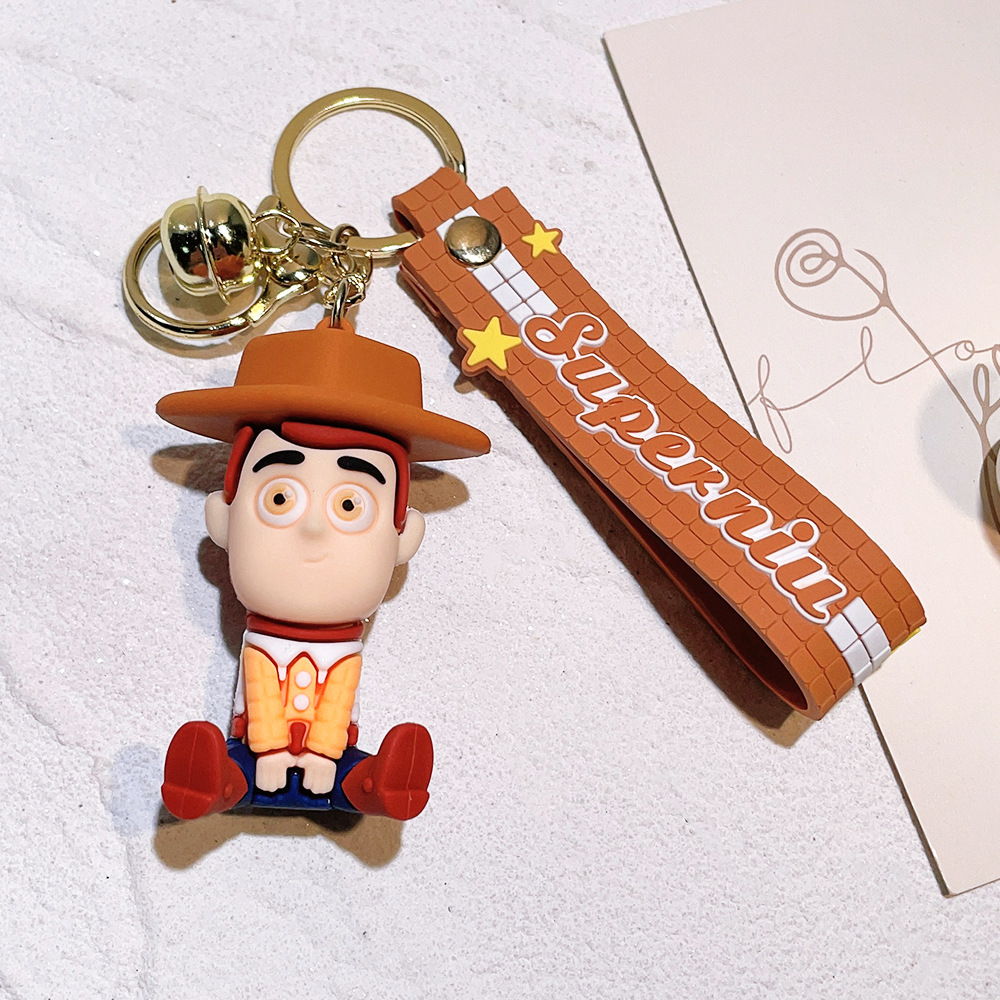 Llavero de silicona de Toy Story, el popular dibujo animado, con personajes como el alienígena de tres ojos, Buzz Lightyear y el oso Lotso, ideal como adorno para bolso.
