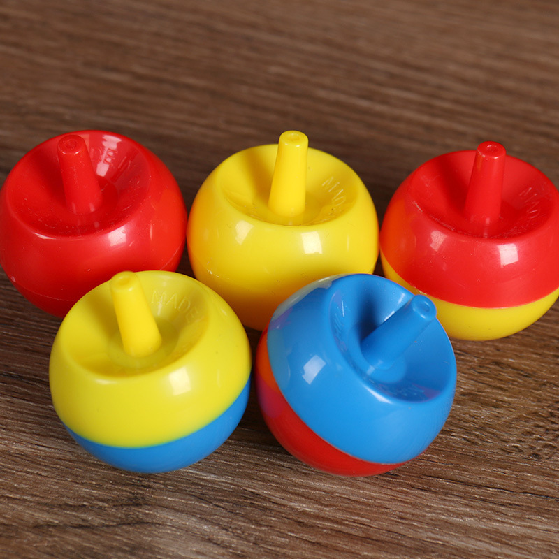 Giroscopio mágico de dos colores de Apple de rotación de la Tierra giroscopio giratorio invertido giroscopio obediente transfronterizo pequeño juguete al por mayor