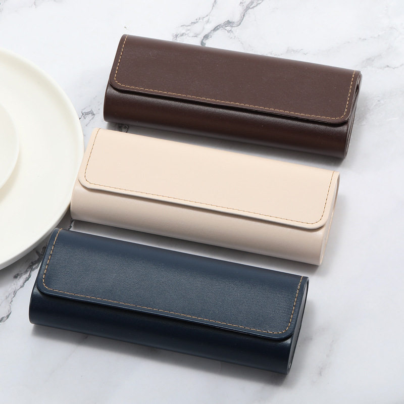 2026 nueva caja de gafas de sol de moda de cuero de dos colores bolsa blando miopía caja de ojos conjunto completo de bolsa de espejo tela