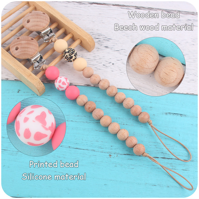 Nuevos suministros para bebés Beech chupete clip calmante bebé macaron cuentas impresas mordedura chupete cadena anti-caída de la cadena