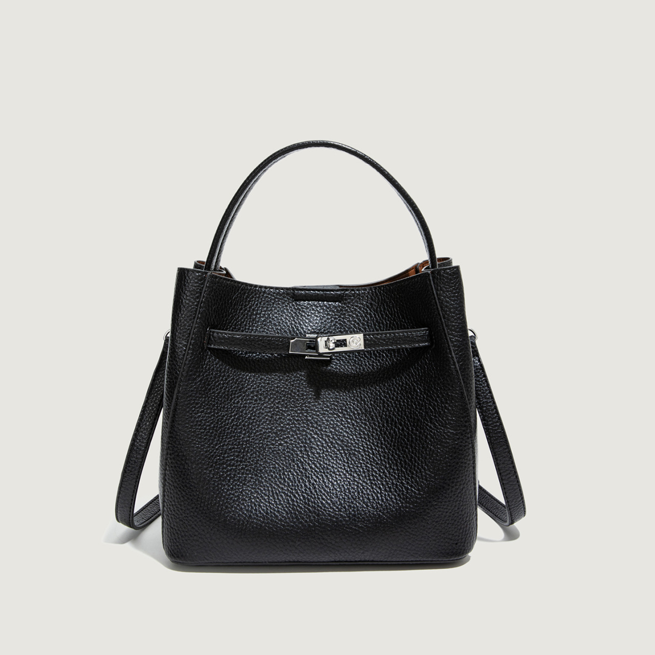 Bolso coreano de cuero suave litchi de gran capacidad de un solo hombro bolso de cubo 2025 nuevo bolso de cinturón de bloqueo para mujeres