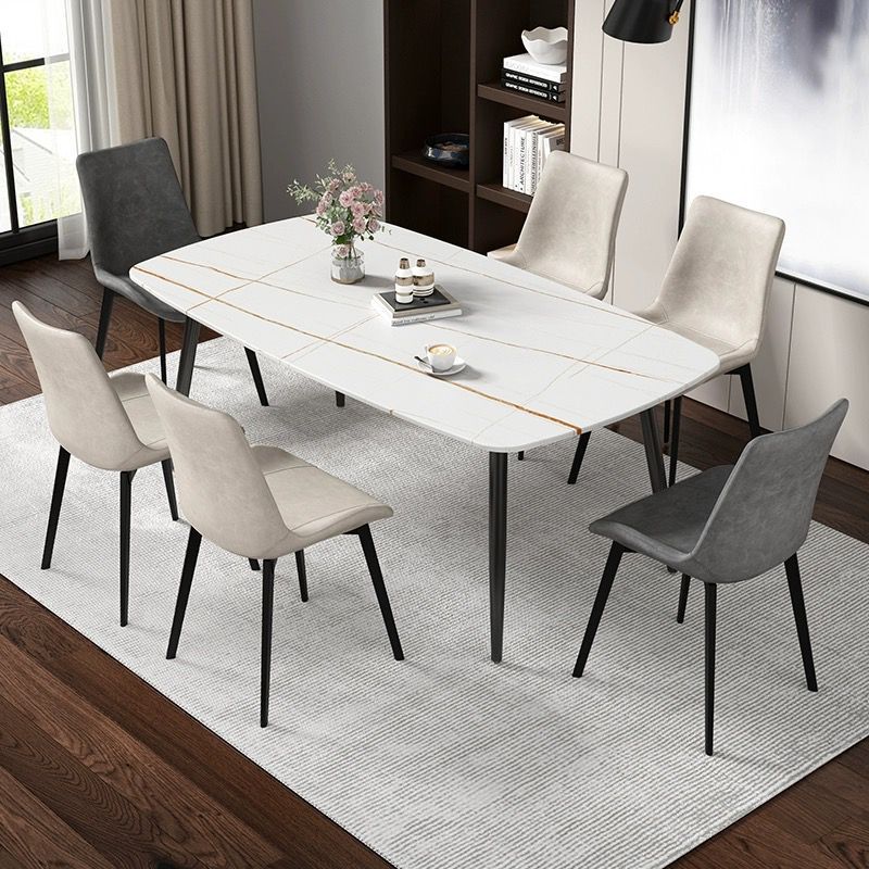 Mesa y silla de comedor de tabla de roca ligera de estilo italiano de lujo, combinación de mesa y silla de comedor de apartamento rectangular moderno y simple.