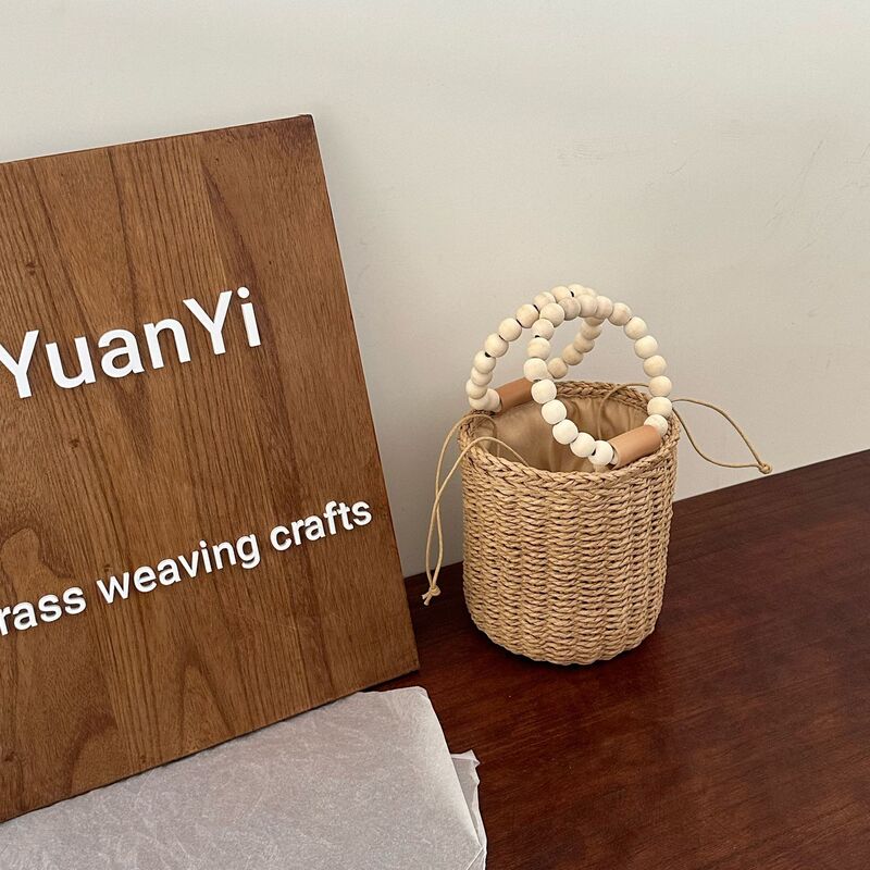 Fashion small fresh cylinder bag paper rope woven bag Mori portable bucket bag casual drawstring beach bag women's bag