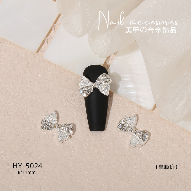 Nuevo arco de uñas amor aleación decoración de uñas flor de la luna mariposa clavo taladro fábrica joyería al por mayor