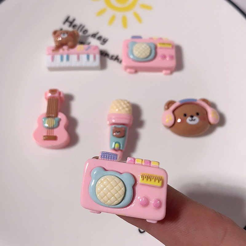 Nuevos dibujos animados brillante cara rosa osos joyería caja de teléfono celular agujero agujero cordón de cabeza de zapato DIY accesorios de resina de pegamento de crema