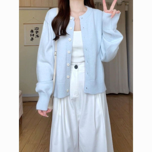 Soft and chewy light-blue knitted sweater for women's outerwear—simple, short cardigan-style jacket perfect for spring, autumn, and winter.