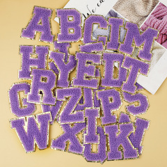 Embroidered letter patch with no-backing glue for clothing decoration, purple towel embroidery, computerized embroidery, and patchwork with a purple towel design.