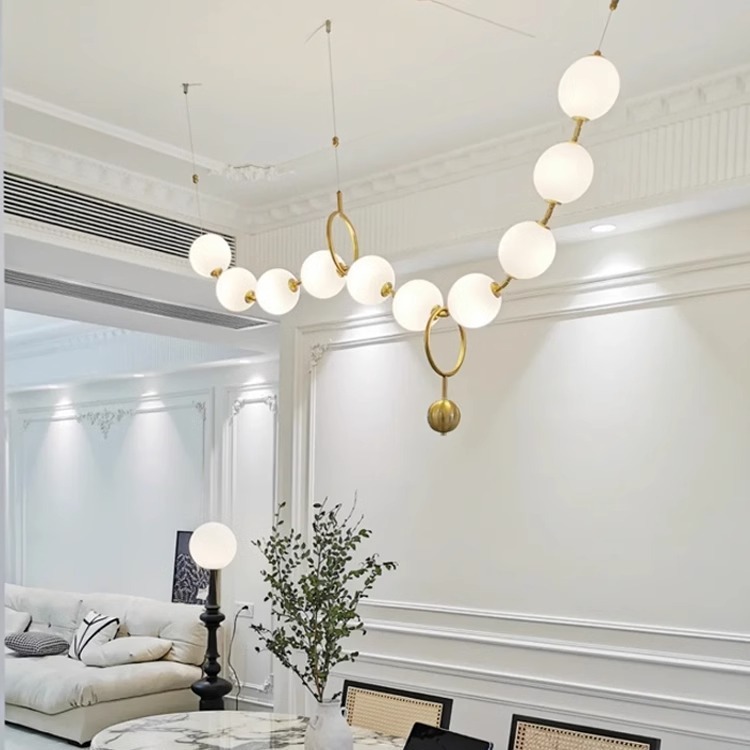 Luz francesa del restaurante de frijoles mágicos moderno simple bronce collar de perlas lámpara de bar largo loft Buda perlas lámpara de bar