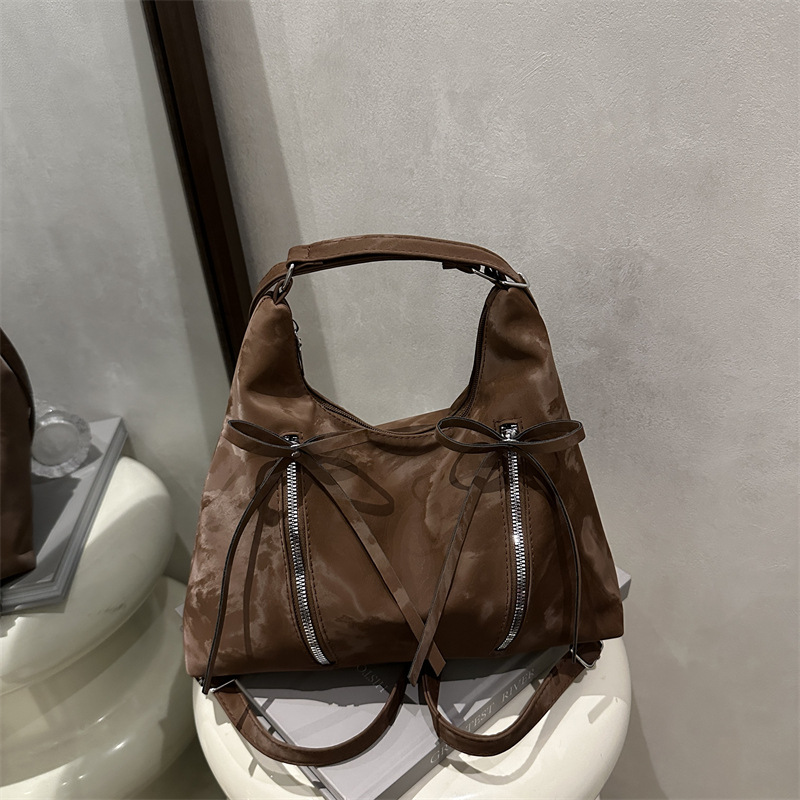 Bolsa de hombro retro suave pitot bolso arco 2025 nueva moda moda coreana bolsa de hombro de gran capacidad casual