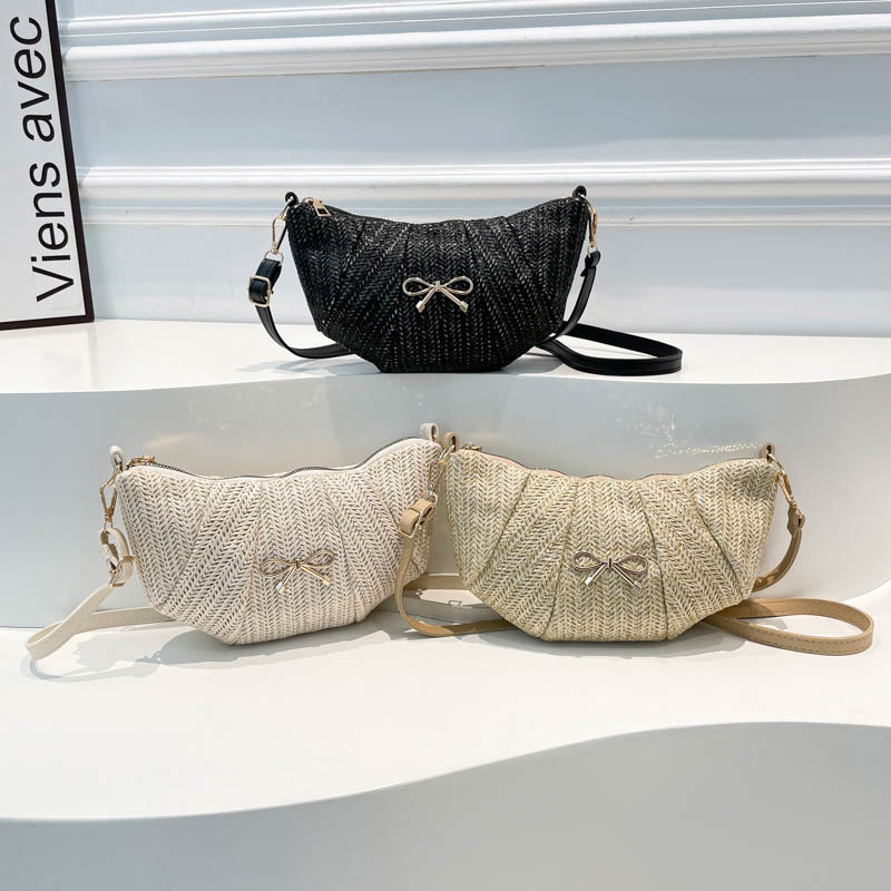 Bolsos tejidos de diseño de nicho para mujer 2025 verano nueva textura comercio exterior casual moda un hombro axila bolsa de bola de masa