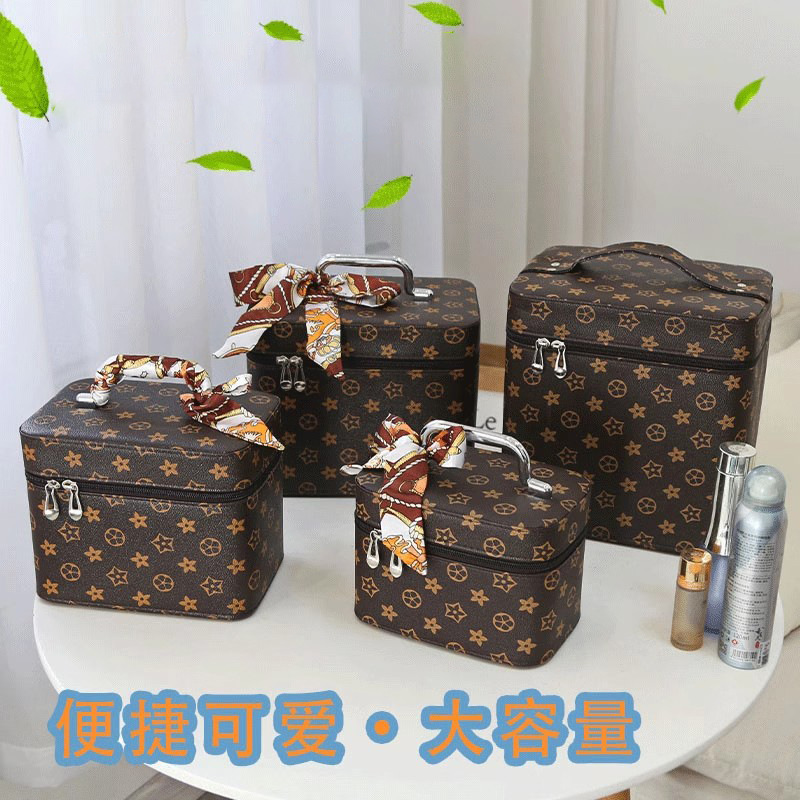Bolsas de maquillaje europeas y estadounidenses transfronterizas de gran capacidad de alta calidad caja de maquillaje portátil de tres piezas conjuntos de exportación de caja de almacenamiento de cosméticos en línea