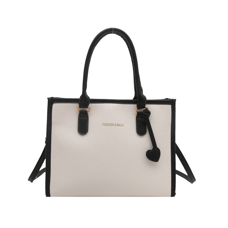 Simple nuevo bolso de mujer, bolso práctico de alto nivel, invierno 2024 nuevo estilo universal en la textura de la bolsa de transporte