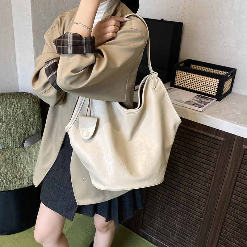 Bolsa de cubo transfronteriza de gran capacidad, bolsa de viaje retro de mujer 2025, otoño y invierno, nueva moda, bolsa de brazo, bolsa de hombro universal