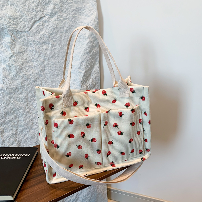 Bolsas de impresión de fresas populares de vello coreana para mujeres verano 2024 nuevo tipo transfronterizo mochila de hombro mochila