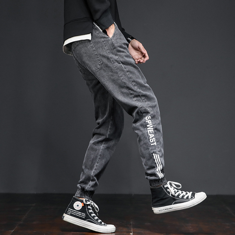 Jeans casuales de cintura elástica sueltos para hombres primavera de moda coreana para hombres, nueve puntos.