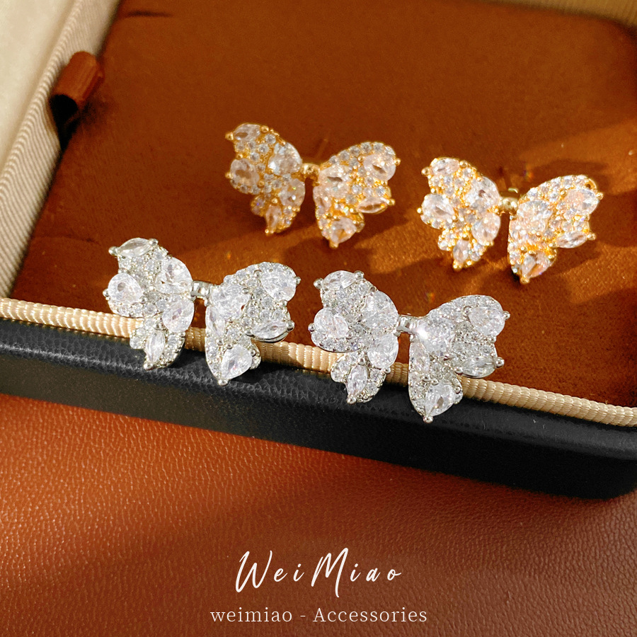 Agujas de plata zircon arco pernos de arco exquisitos moda de transporte universal temperamento ligero lujo alta sensación de aretes al por mayor