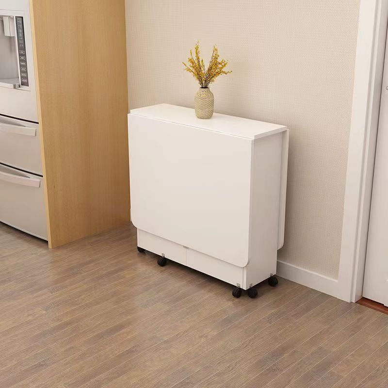 Mesa de comedor plegable doméstica pequeña casa con rueda móvil retráctil rectangular simple y multifuncional mesa de comedor pequeña