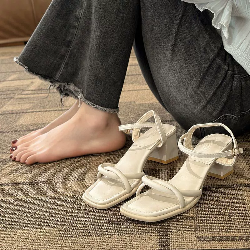 White summer sandals with a strap, suitable with a skirt