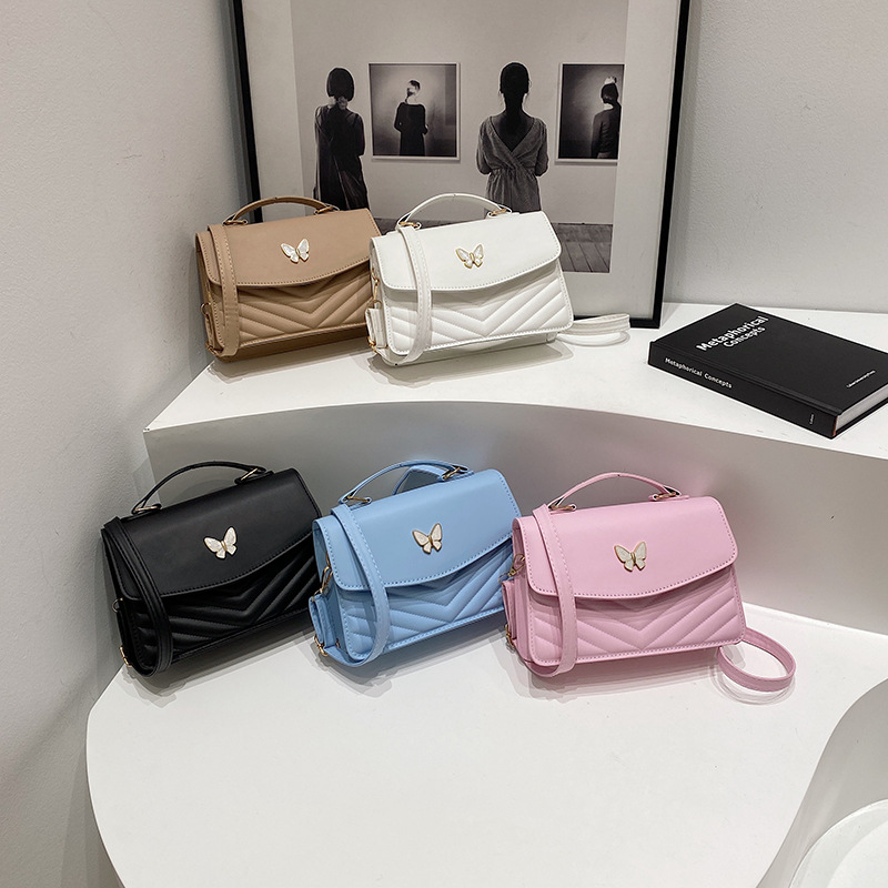 Bolso bordado de color sólido otoño y invierno 2024 nuevo estilo retro bolso de moda simple bolso de mariposa de moda