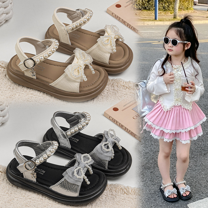 Zapatos de arco de niñas 2026 verano nuevos zapatos de princesa de estilo extranjero zapatos de moda para niñas zapatos de soleas suaves zapatos de soja
