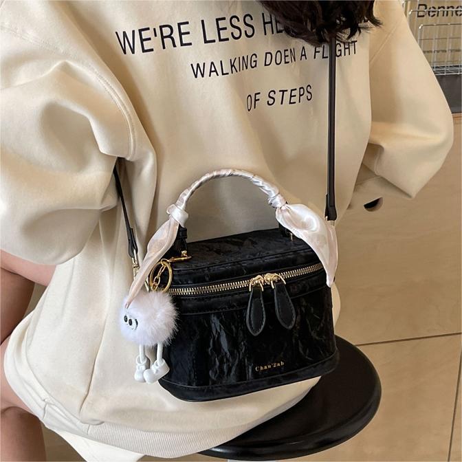 Bolsos versátiles sencillos de alta calidad para mujeres 2026 primavera y verano nuevo nicho bolso de cubo de diseño coreano bolso de hombro