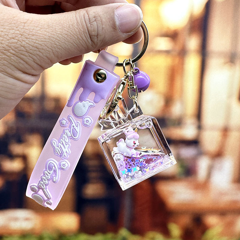 Púrpura estrella de cinco puntas líquido Quicksand llavero chica corazón flor de cerezo aceite colgante lindo tridimensional mochila adornos para mujeres