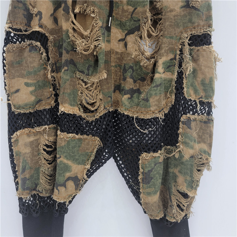 Personalidad nicho moda mujer 2025 verano nuevo estilo malla hueca costura nueve puntos camuflaje pantalones de entrepierna