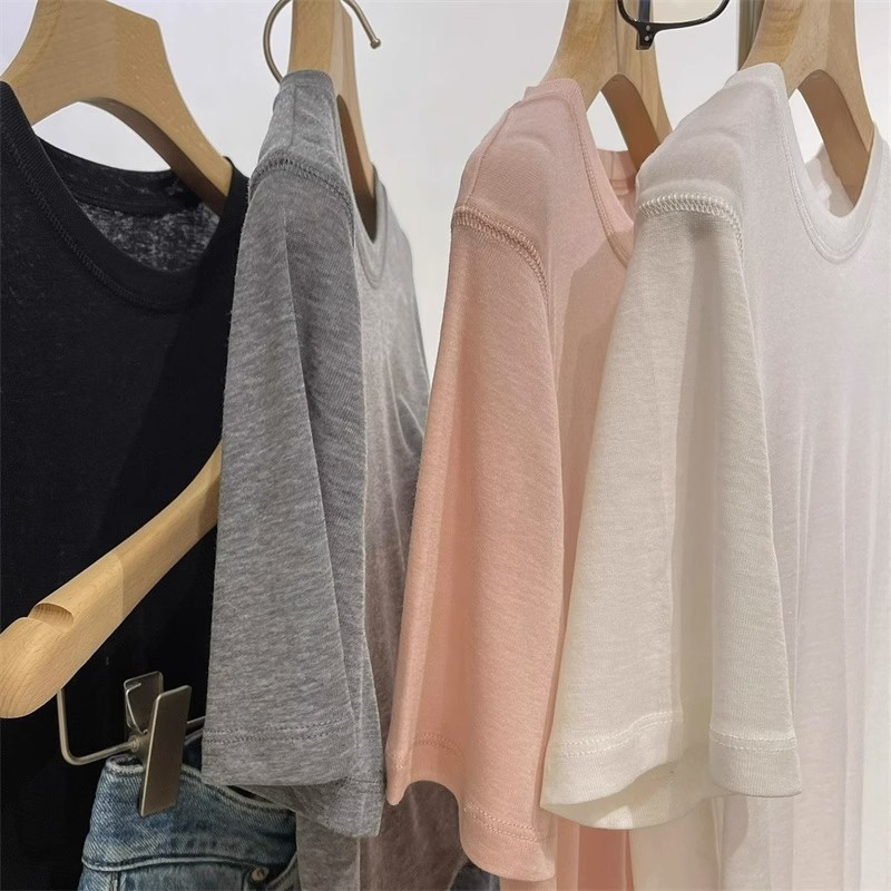 White base knitted summer T-shirt with a round collar