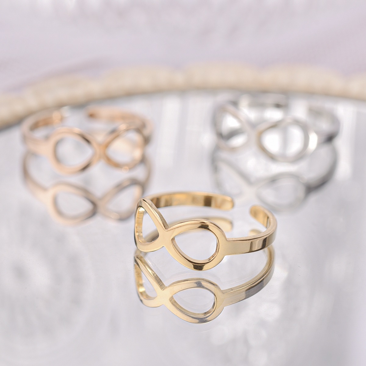 Fashion new 8-character bow titanium steel 24K gold couple ring