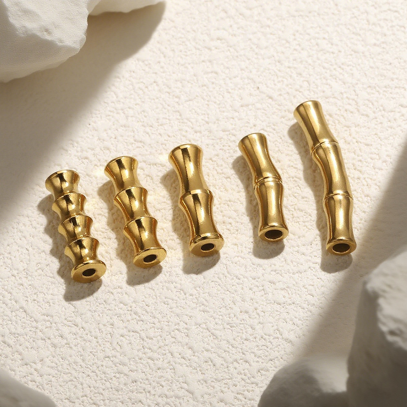 Acero inoxidable dorado bambú curva pequeña perla de pez accesorios de material de cuerda tejida a mano accesorios de pulsera cuentas de acero DIY accesorios