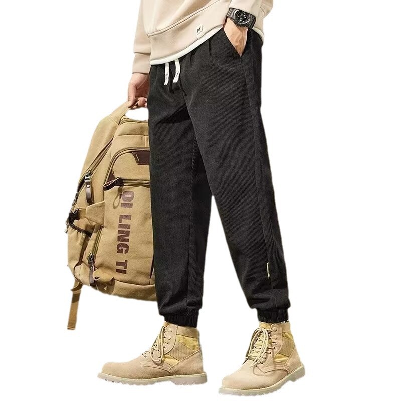 Pantalones casuales de cordillera de hombre, pantalones de caño, pantalones de marca de moda, pantalones de nueve puntos, moda variada.