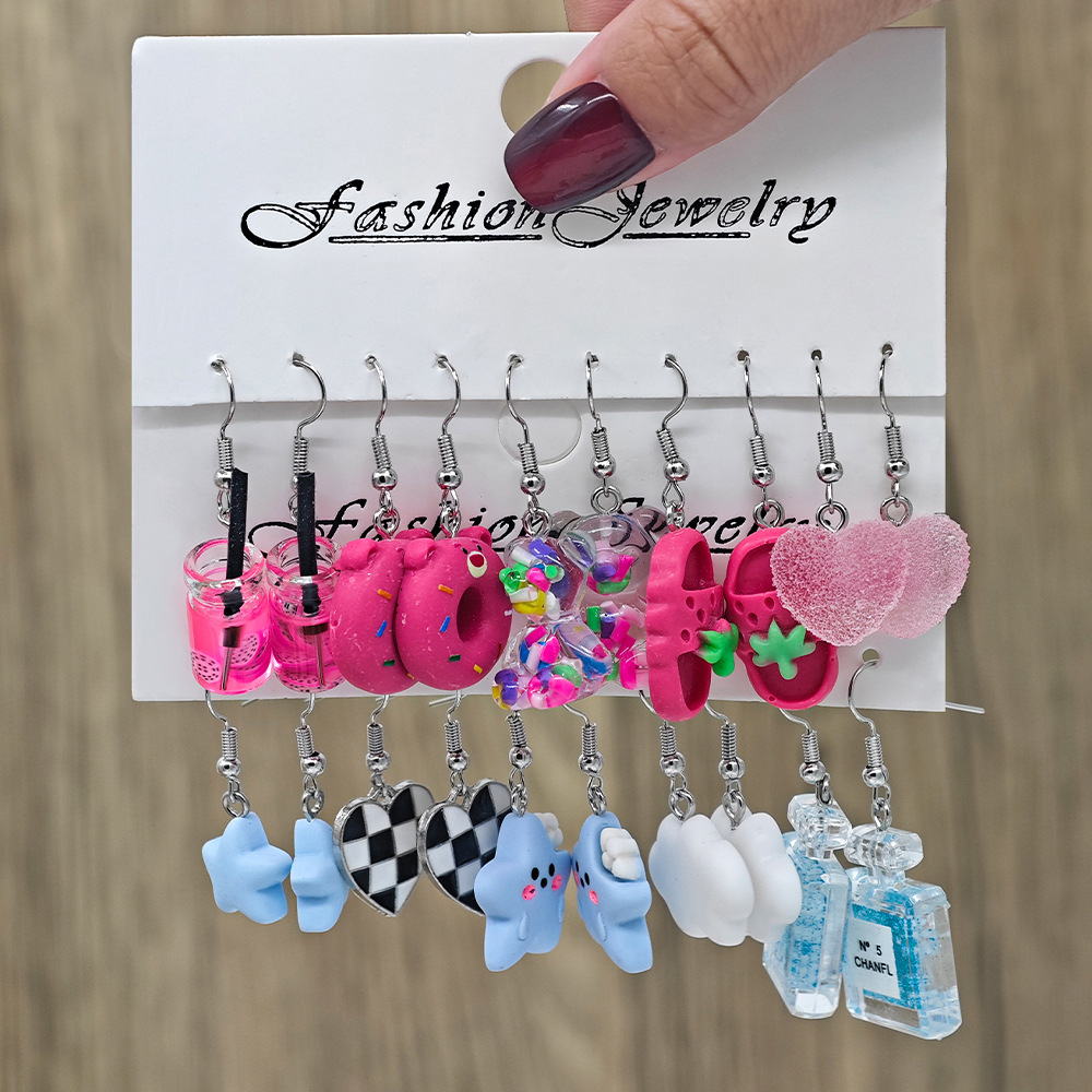 Moda transfronteriza de venta caliente de dibujos animados animales de caballo blanco resina de margarita simulación de alimentos donut auriculares multi-pieza conjunto