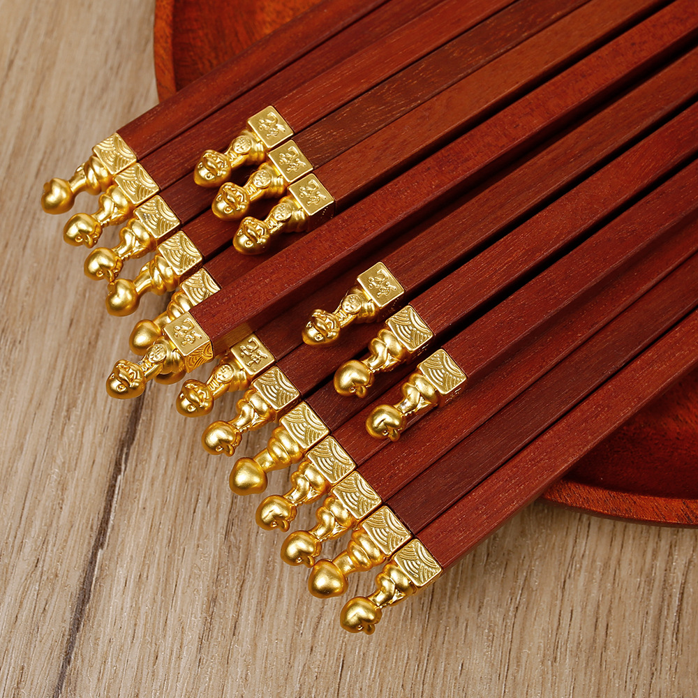 Palillos de madera con forma de alita de pollo para uso doméstico, palillos de madera maciza con parte superior redonda antideslizante, palillos de madera con parte superior de metal para uso comercial, palillos de regalo de madera sin pintura y sin cera.