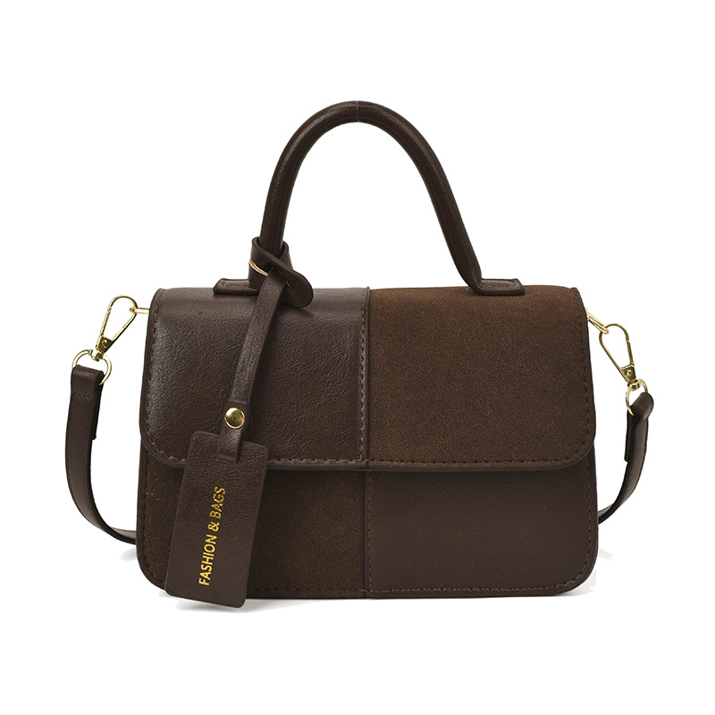 Bolsos de mano de textura alta para mujeres 2025 nueva tendencia europea y americana cruzada retro empalme versátil mochila
