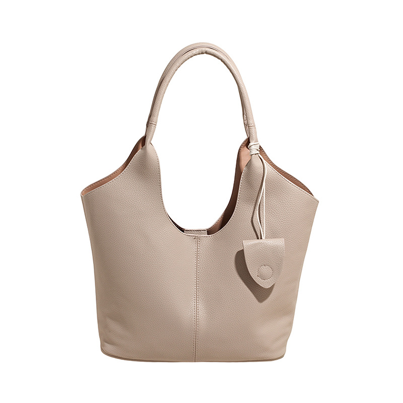 Versión coreana del bolso de alta capacidad 2025 nuevo bolso de cubo de todo fósforo de moda bolso de hombro simple bolso de axila de color sólido