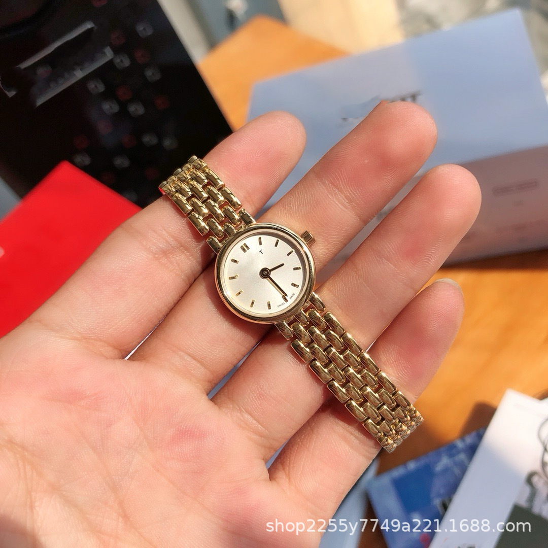 Caja de regalo de contador de reloj pequeño dorado