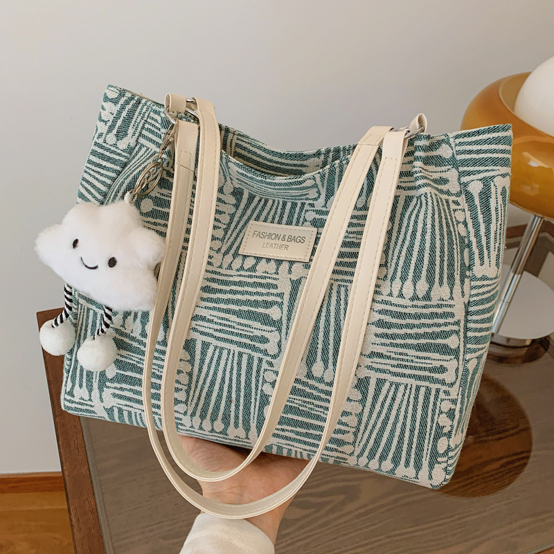 Bolsa multipropósito coreana de hombro de mujer, nicho de diseño de textura portátil, bolso de hombro de mujer, pequeño bolso fresco.