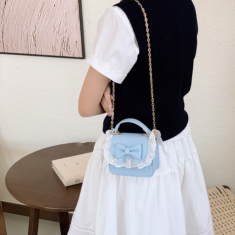 Bolsos de hombro de encaje extranjero para hombres y mujeres, bolsas de cadena de arco mini lindas coreanas nuevas bolsas para niños