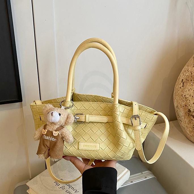 Bolso de cubo de estilo explosivo de moda para mujer 2025 nuevo bolso de hombro de nicho de todo fósforo tejido de estilo occidental bolso de mensajero de mano de moda