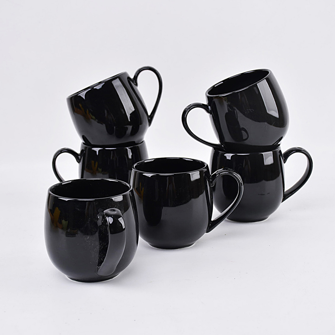 black A set of four six ceramic mugs for hot beverages