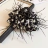 Black and white leopard pattern feathers grab