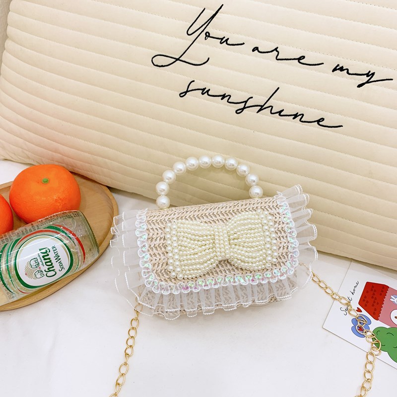 2025 nuevo regalo para niñas para niñas jardín de infantes Día de los niños arco de perla tela de paja bolso de hombro