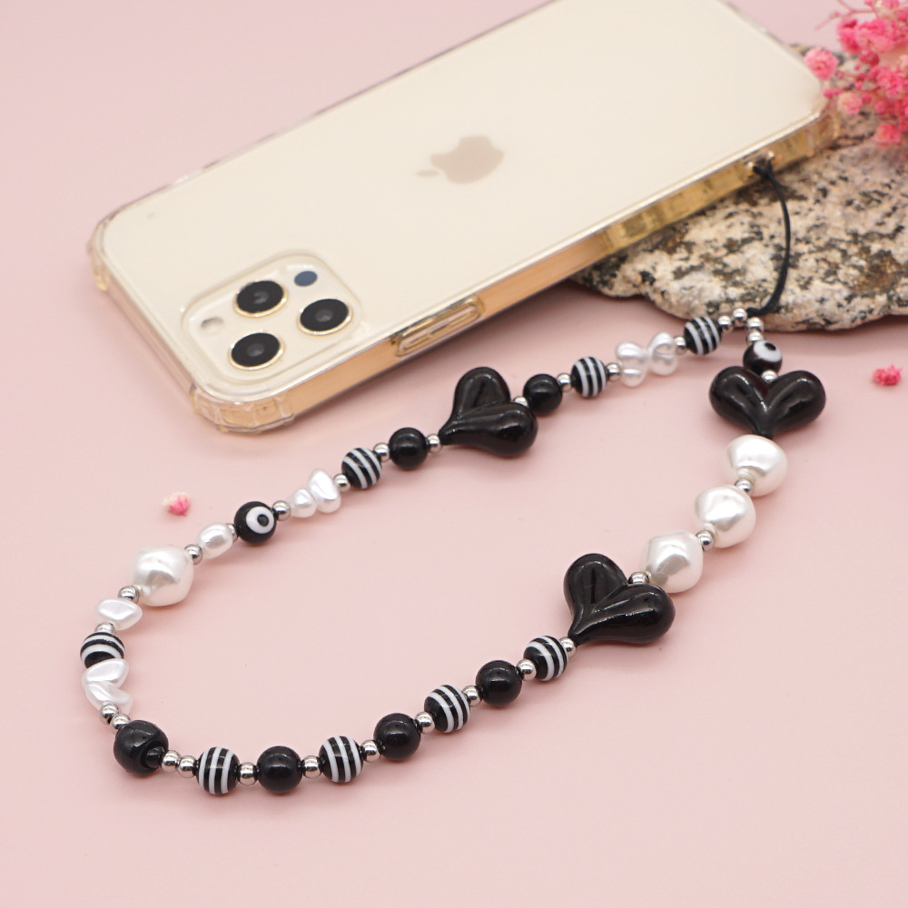 Estilo Étnico Negro En Forma De Corazón A Rayas De Cuentas Redondas Correa De Teléfono Móvil Venta Al Por Mayor Nihaojewelry display picture 6