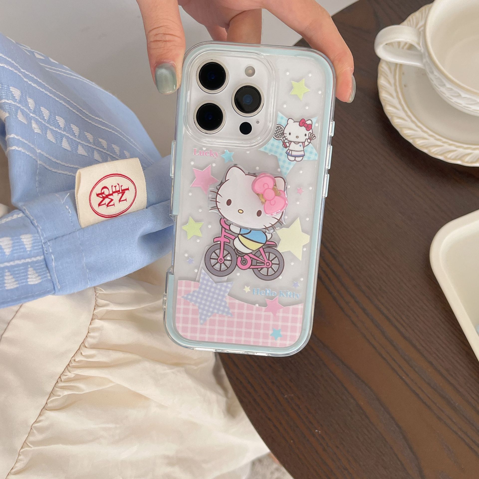 Lindo paseo en bicicleta de dibujos animados KT gato para Apple 15/16 funda para teléfono móvil 14ProMax dos en uno 16Pro femenino 16PM