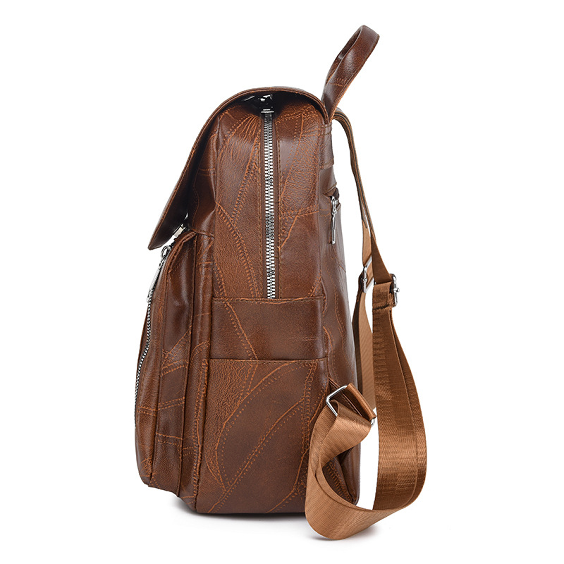 Comercio exterior al por mayor 2023 nueva versión coreana de las señoras de cuero suave mochila de viaje al aire libre retro de moda mochila escolar de moda