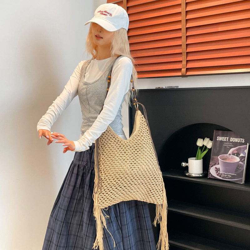 Bolso de vacaciones junto al mar 2025 verano nuevo estilo bolso de hombro tejido con flecos bolso de mensajero de gran capacidad mujer